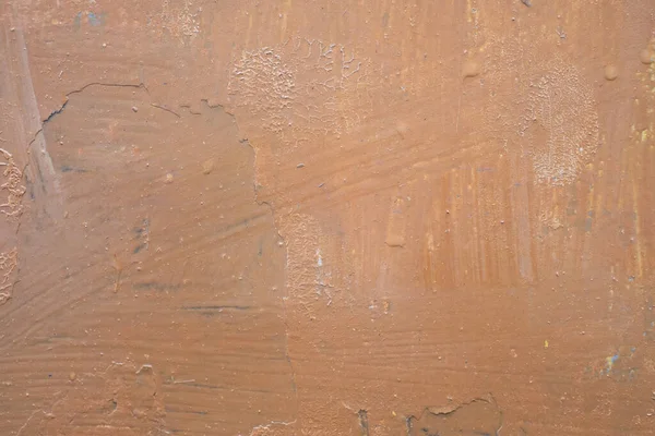 Kahverengi yağlı boyayla boyanmış eski bir duvarın dokusu.