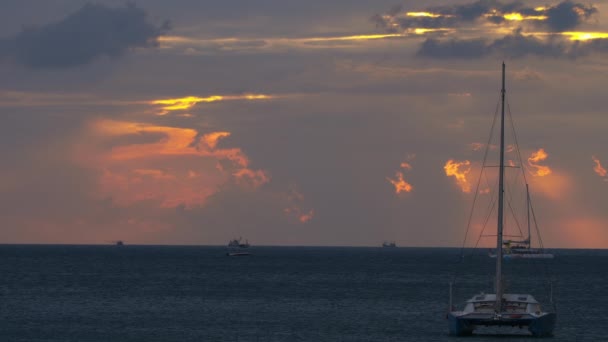 Yachts at sea at sunset — стоковое видео