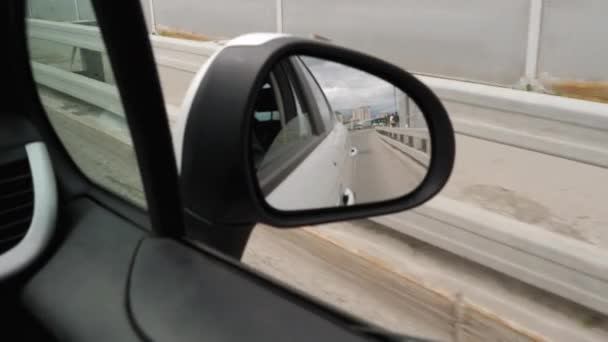 Side mirror view of a moving car — Stock Video