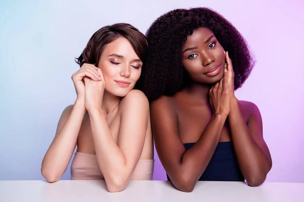 Photo of two gorgeous happy, ladies closed eyes arm touch cheek passion isolated on vivid neon background — Stock Photo, Image
