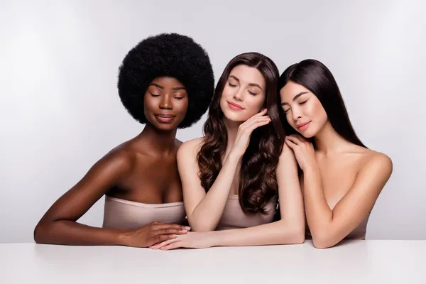 Photo of three young attractive woman dream enjoy sensual perfection bodycare isolated over grey color background — Stock Photo, Image