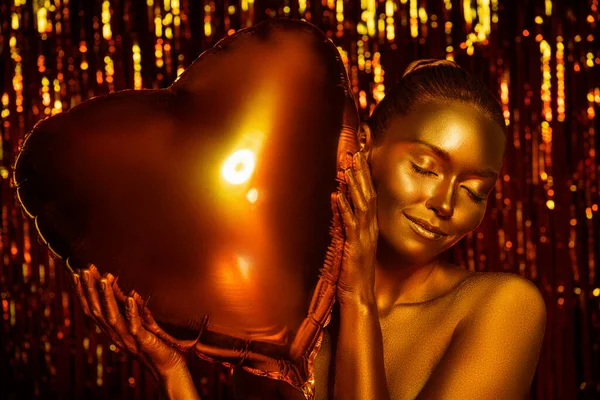 Photo of shiny glossy dreamy lady closed eyes hold hug heart balloon bonding isolated vivid sparkling tinsels backdrop — Stock Photo, Image