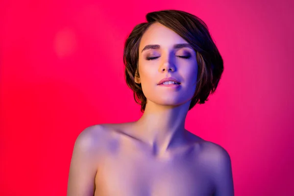 Photo of tender short hairdo young lady bite lip closed eyes isolated on vibrant neon red color background — Stock Photo, Image