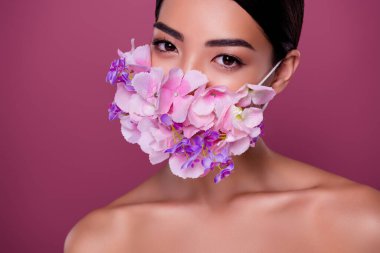 Close up photo of lady have treatment against flower pollen wear floral respiratory mask isolated pink color background.
