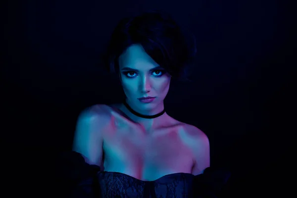 Photo of stunning scary lady zombie in vintage clothes enchant isolated on ultraviolet effect color background.