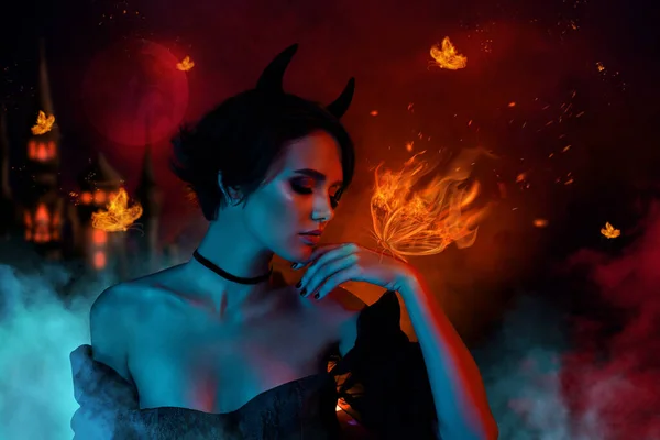 Picture collage of lady satan look mystically hand fire drawing butterfly isolated on dark mist color hell background.
