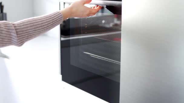 Woman Hands Open Oven Pull Baking Sheet Out Oven Slow — Stock video