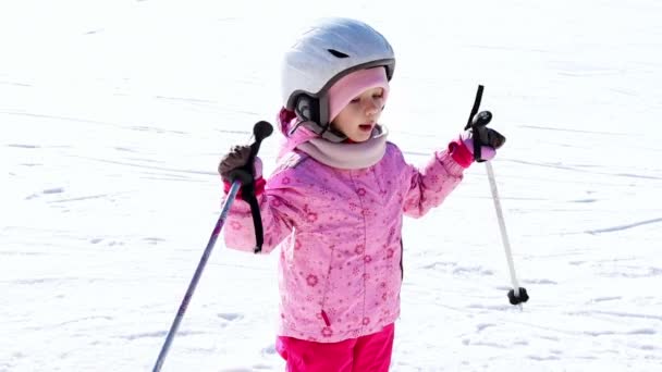 Little Girl Waves Ski Poles Slow Motion Winter Activity Concept — Stockvideo