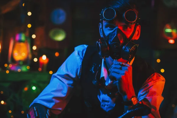 Man in a cyberpunk suit with a gas mask and glasses — Stock Photo, Image