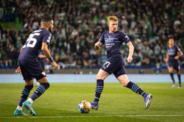 UEFA Champions League Round of 16, 15.02.2022 - Estadio Jose Alvalade, Lisbon; Sporting CP - Manchester City FC; De Bruyne passes the ball to Mahrez clipart