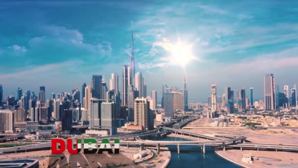 AERIAL. View to the Dubai city centre from the drone. Dubai lettering on the front side video. — Stock Video