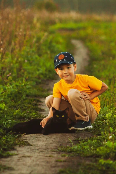 Boy Yellow Shirt Blue Cap Black Cat Nature — Stock Photo, Image