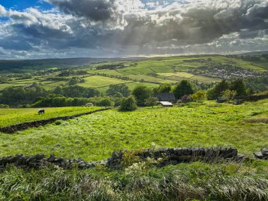 Sun breaking through the storm clouds on the Pennine Way in, Yorkshire, UK