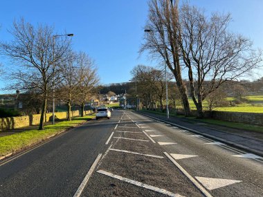 Looking up, Cottingley Cliffe Road, on a sunny winters day near, Cottingley, Bingley, UK