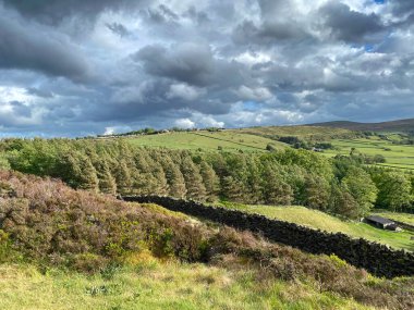 Landscape view with rain clouds, over the hills toward Haworth,