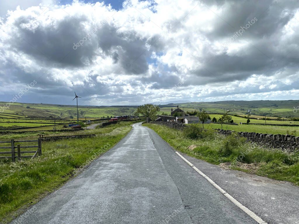 Rain showers, over the fields and farms on, Piper Lane, Cowling, Lancashire, UK