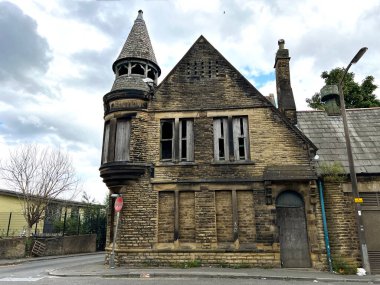 Unusual dark Victorian derelict stone building, on Church Street, with heavy clouds above, in the post indstrial city of, Bradford, UK