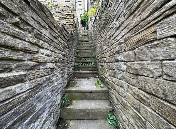 Old stone steps, leading to Victorian houses on, Mill Hill Lane, Brighouse, UK