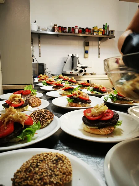 The process of making hamburgers with homemade buns and cutlets