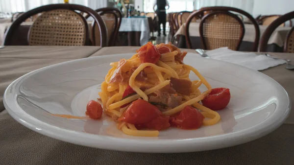Italian pasta with spicy tomato sauce and meat
