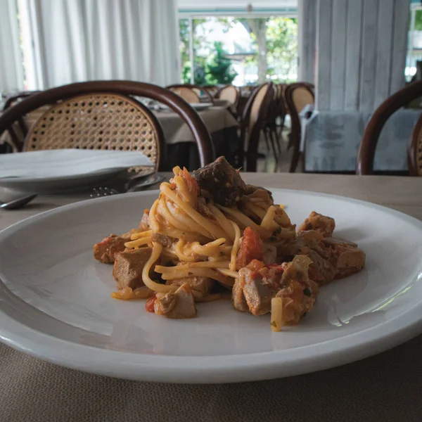 Italian pasta with spicy tomato and tuna sauce