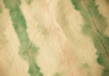 Bej rengi kravat boyalı batik. Suluboya boya fırçası. Kirli Arkaplan. Yeşil Kova Boyası. Eski Graffiti tarzı. Yağlı fırça. Antika Yağ Mürekkebi. Bej Graffiti Biçimi.