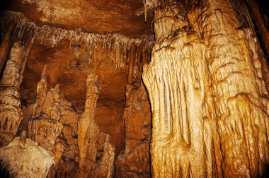 Stalactites and stalagmites in a cave. Excursions to the caves for tourists.