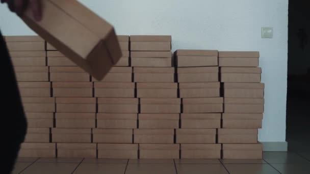 Young Girl Puts Cardboard Box Gifts Row Other Crafted Boxes — Stock Video