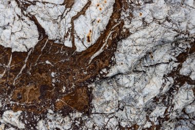 Kırsal taşlar, paslanmış dokular, renkli ve ilginç arka planlar ve büyüleyici dokular, web tasarımı ve soyut arkaplanlar için kullanılır.