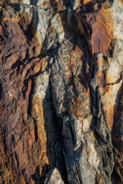 Kırsal taşlar, paslanmış dokular, renkli ve ilginç arka planlar ve büyüleyici dokular, web tasarımı ve soyut arka plan için kullanılır.