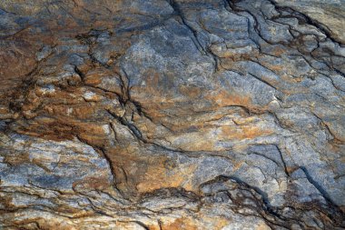 Kırsal taşlar, paslanmış dokular, renkli ve ilginç arka planlar ve büyüleyici dokular, web tasarımı ve soyut arka plan için kullanılır.