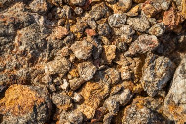 Kırsal taşlar, paslanmış dokular, renkli ve ilginç arka planlar ve büyüleyici dokular, web tasarımı ve soyut arka plan için kullanılır.