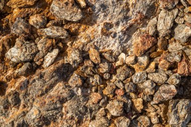 Kırsal taşlar, paslanmış dokular, renkli ve ilginç arka planlar ve büyüleyici dokular, web tasarımı ve soyut arka plan için kullanılır.