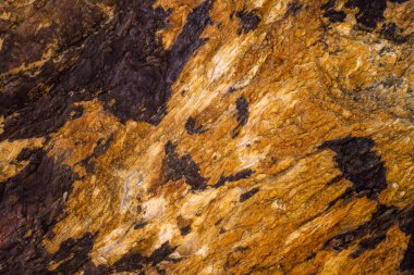 Kırsal taşlar, paslanmış dokular, renkli ve ilginç arka planlar ve büyüleyici dokular, web tasarımı ve soyut arka plan için kullanılır.