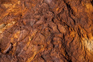 Kırsal taşlar, paslanmış dokular, renkli ve ilginç arka planlar ve büyüleyici dokular, web tasarımı ve soyut arka plan için kullanılır.