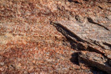 Kırsal taşlar, paslanmış dokular, renkli ve ilginç arka planlar ve büyüleyici dokular, web tasarımı ve soyut arka plan için kullanılır.