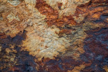 Kırsal taşlar, paslanmış dokular, renkli ve ilginç arka planlar ve büyüleyici dokular, web tasarımı ve soyut arka plan için kullanılır.