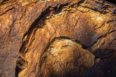 Kırsal taşlar, paslanmış dokular, renkli ve ilginç arka planlar ve büyüleyici dokular, web tasarımı ve soyut arka plan için kullanılır.