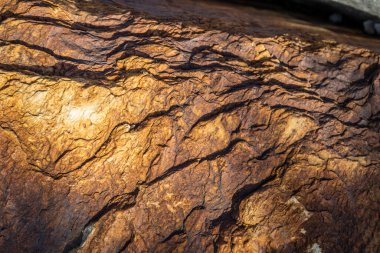 Kırsal taşlar, paslanmış dokular, renkli ve ilginç arka planlar ve büyüleyici dokular, web tasarımı ve soyut arka plan için kullanılır.