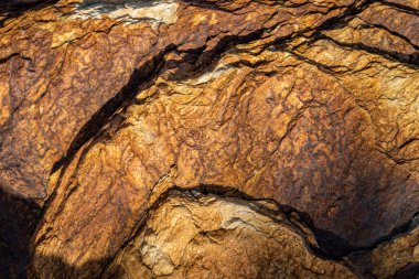 Kırsal taşlar, paslanmış dokular, renkli ve ilginç arka planlar ve büyüleyici dokular, web tasarımı ve soyut arka plan için kullanılır.