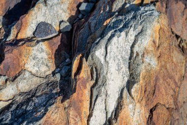 Kırsal taşlar, paslanmış dokular, renkli ve ilginç arka planlar ve büyüleyici dokular, web tasarımı ve soyut arka plan için kullanılır.