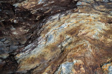 Kırsal taşlar, paslanmış dokular, renkli ve ilginç arka planlar ve büyüleyici dokular, web tasarımı ve soyut arkaplanlar için kullanılır.