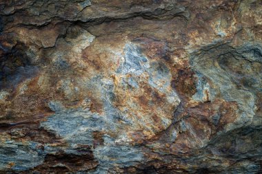 Kırsal taşlar, paslanmış dokular, renkli ve ilginç arka planlar ve büyüleyici dokular, web tasarımı ve soyut arkaplanlar için kullanılır.