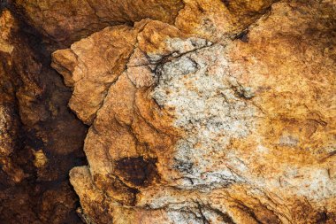 Kırsal taşlar, paslanmış dokular, renkli ve ilginç arka planlar ve büyüleyici dokular, web tasarımı ve soyut arkaplanlar için kullanılır.