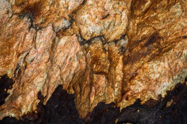 Kırsal taşlar, paslanmış dokular, renkli ve ilginç arka planlar ve büyüleyici dokular, web tasarımı ve soyut arkaplanlar için kullanılır.