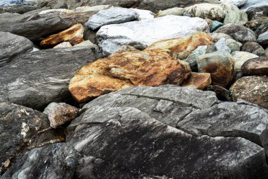 Kırsal taşlar, paslanmış dokular, renkli ve ilginç arka planlar ve büyüleyici dokular, web tasarımı ve soyut arkaplanlar için kullanılır.