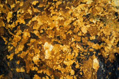 Kırsal taşlar, paslanmış dokular, renkli ve ilginç arka planlar ve büyüleyici dokular, web tasarımı ve soyut arkaplanlar için kullanılır.