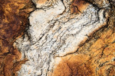 Kırsal taşlar, paslanmış dokular, renkli ve ilginç arka planlar ve büyüleyici dokular, web tasarımı ve soyut arkaplanlar için kullanılır.