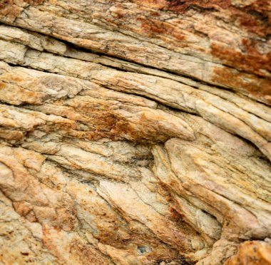 Kırsal taşlar, paslanmış dokular, renkli ve ilginç arka planlar ve büyüleyici dokular, web tasarımı ve soyut arkaplanlar için kullanılır.