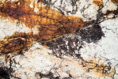 Kırsal taşlar, paslanmış dokular, renkli ve ilginç arka planlar ve büyüleyici dokular, web tasarımı ve soyut arkaplanlar için kullanılır.